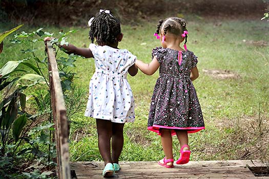 girls playing and holding hands